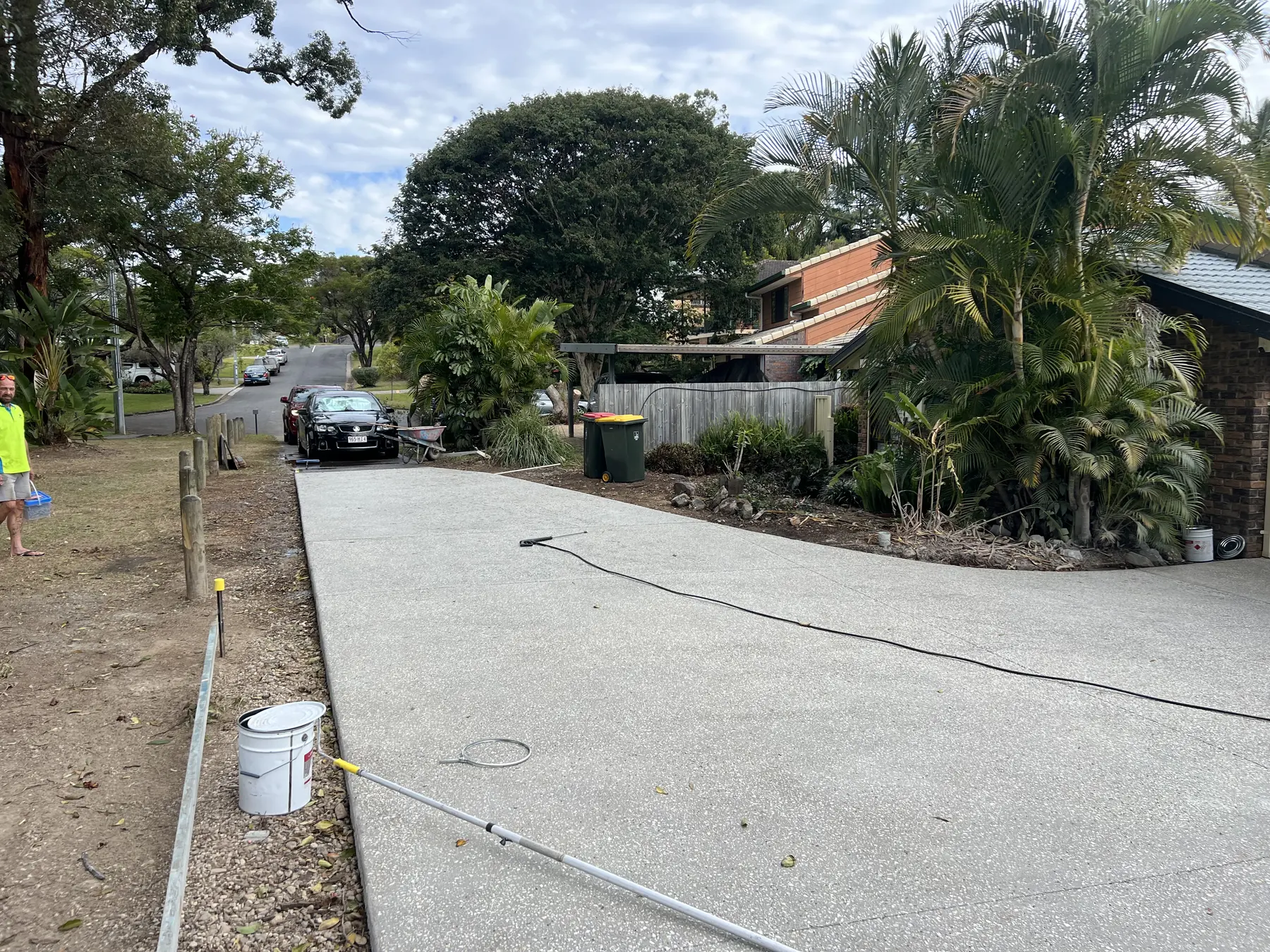 Long driveway finished under a tree-lined street